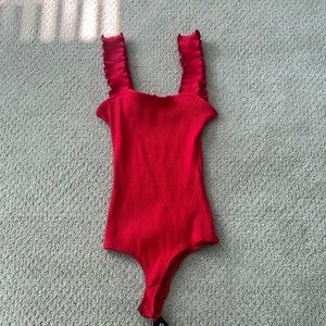 Francesca’s red bodysuit